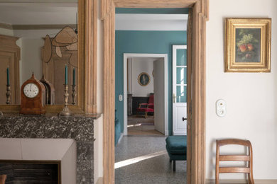 Inspiration for a large transitional hallway in Lyon with beige walls and terrazzo floors.