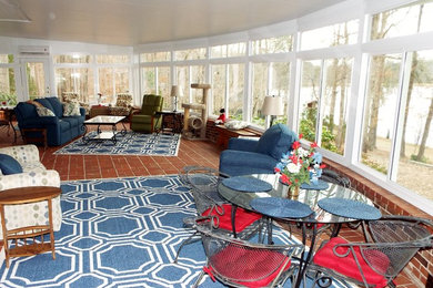 Example of a large classic brick floor and brown floor sunroom design in Other with a standard ceiling