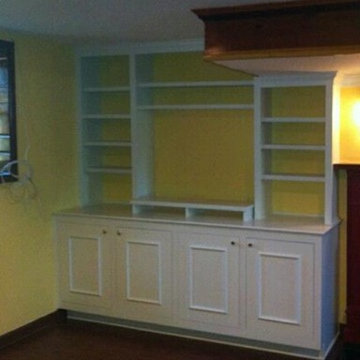 Bookcase with base unit below. Ther is a matching unit on the other side of the