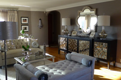 Example of a mid-sized classic formal and enclosed light wood floor living room design in Seattle with gray walls, a standard fireplace, a plaster fireplace and no tv