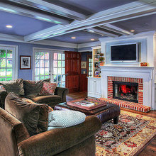 family room with large television & fireplace