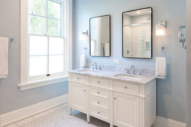 Example of a mid-sized classic master white tile and ceramic tile marble floor, gray floor and double-sink alcove shower design in Richmond with recessed-panel cabinets, white cabinets, a two-piece toilet, blue walls, an undermount sink, marble countertops, a hinged shower door, gray countertops and a freestanding vanity