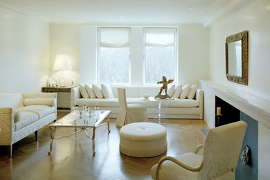 Mid-sized elegant enclosed and formal medium tone wood floor and brown floor living room photo in New York with no tv, white walls, a standard fireplace and a concrete fireplace
