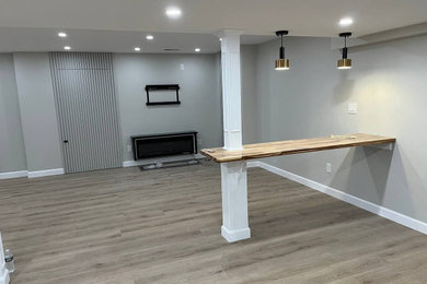Inspiration for a large contemporary vinyl floor multiuse home gym remodel in Boston with gray walls