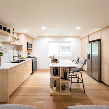 Galley Kitchen with Oak Cabinetry and Island Seating