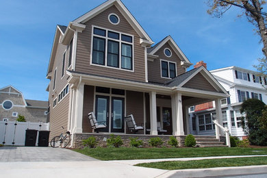 Mid-sized traditional brown two-story vinyl gable roof idea in Other