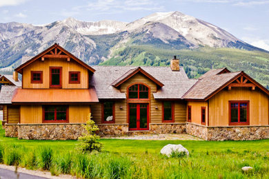 Example of a transitional exterior home design in Denver