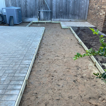 Soil excavated her and borders set in preparation for the gravel base to be buil