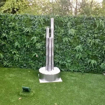 Artificial hedge & grass create maintenance free garden