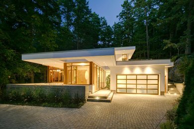 Example of a mid-sized minimalist white one-story stucco exterior home design in Vancouver