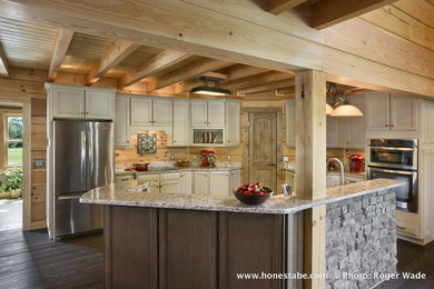 Mid-sized mountain style dark wood floor kitchen photo in Nashville with recessed-panel cabinets, gray cabinets, quartz countertops, stainless steel appliances and an island