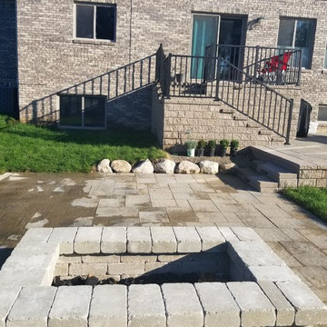 Three Tiered Unilock Patio on a waterfront.
