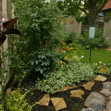 Formal Gardens in Front and Pondless Stream in Backyard