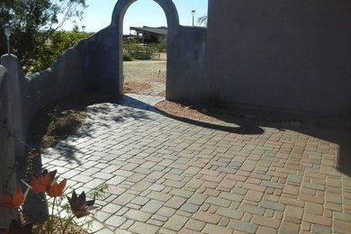 Design ideas for a mid-sized shade backyard brick garden path in Phoenix.