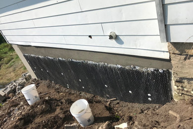 Failing foundation wall replacement and waterproofing