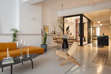 Photo of a contemporary living room in Alicante-Costa Blanca with concrete flooring.