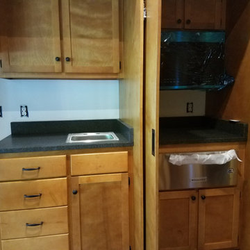 Paneled boardroom with hidden kitchen