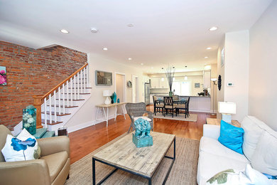 Mid-sized traditional formal open concept living room in DC Metro with medium hardwood floors and white walls.