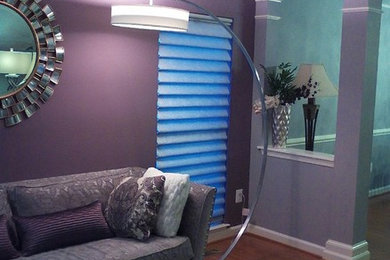 Mid-sized transitional formal and enclosed medium tone wood floor and brown floor living room photo in DC Metro with purple walls, no fireplace and no tv