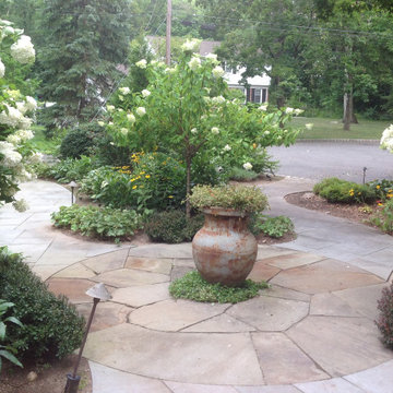 Irregular, multicolor bluestone sets off center of entry paving