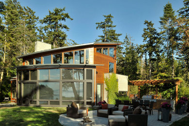 Inspiration for a mid-sized contemporary two-storey exterior in Seattle with wood siding.