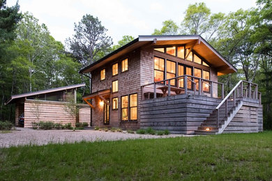 Example of a mid-sized transitional two-story wood exterior home design in Boston with a metal roof