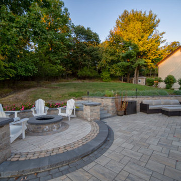 Dual patio with adjoining firepit feature