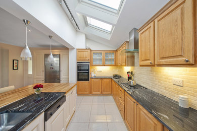 Inspiration for a large traditional l-shaped open plan kitchen in Dublin with a peninsula.