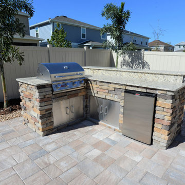 Custom Swimming Pool with Granite Tabletop and Spillway