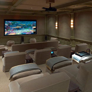 Home theater - large traditional enclosed carpeted and beige floor home theater idea in Dallas with a projector screen and gray walls