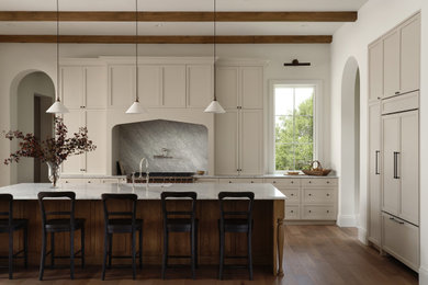 Transitional kitchen photo in Austin with marble countertops and marble backsplash