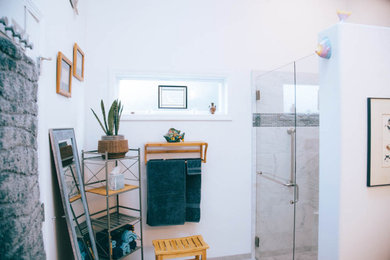 Inspiration for a mid-sized transitional master multicolored tile and glass sheet double-sink bathroom remodel in Portland with a two-piece toilet, white walls, an undermount sink, quartz countertops, a hinged shower door, gray countertops and a built-in vanity
