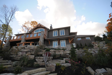 Craftsman one-story mixed siding exterior home idea in Toronto with a hip roof