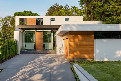 Mid-sized trendy beige two-story mixed siding flat roof photo in Minneapolis