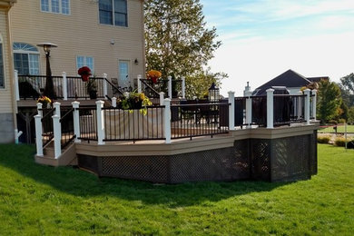 Deck - mid-sized contemporary backyard deck idea in New York