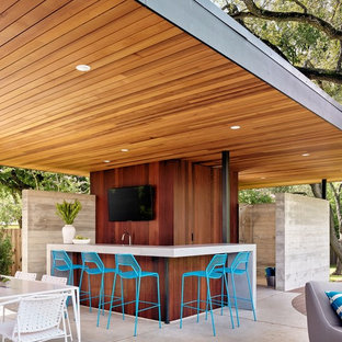 Photo of a contemporary patio in Austin with a roof extension.
