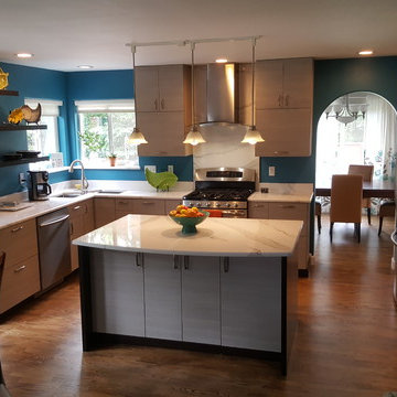 This is a two tone updated kitchen with efficient use of space & feature points