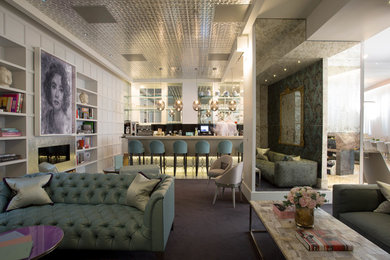 Design ideas for a medium sized contemporary open plan living room in London with a home bar, blue walls, carpet, a standard fireplace and a metal fireplace surround.