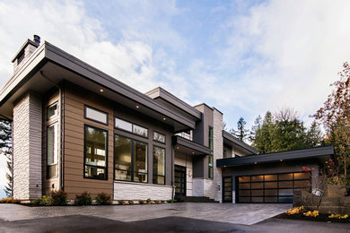 Photo of a contemporary exterior in Other with mixed siding.