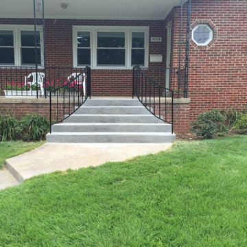 Fanned Out Concrete Stairs in Silver Spring MD With Curved Iron Railing