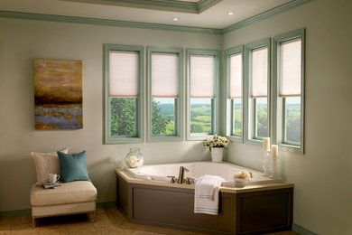 Example of a large trendy master medium tone wood floor and brown floor corner bathtub design in Ottawa with white walls