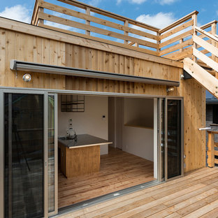 他の地域のアジアンスタイルのおしゃれな屋上のデッキ (日よけなし) の写真