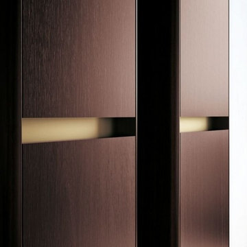 Contemporary bathroom with medium wood color and metallic features