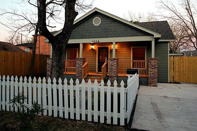 Small traditional gray one-story wood exterior home idea in Houston with a shingle roof