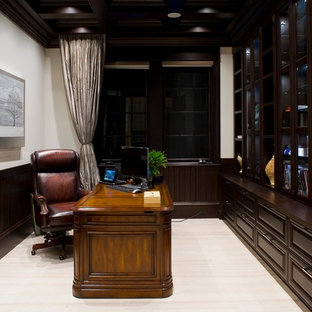 Medium sized modern study in Vancouver with white walls, travertine flooring, no fireplace and a freestanding desk.