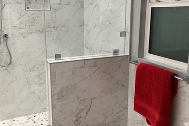 Inspiration for a small contemporary 3/4 gray tile, white tile and marble tile marble floor and gray floor corner shower remodel in Los Angeles with gray walls and a hinged shower door