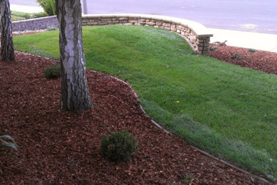 Design ideas for a mid-sized drought-tolerant front yard stone and stone fence landscaping in San Francisco.