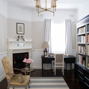 Transitional home office in Sydney with a corner fireplace and a freestanding desk.