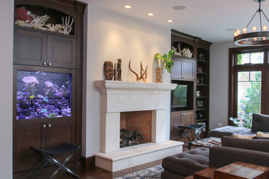 Transitional open concept medium tone wood floor living room photo in Chicago with a standard fireplace