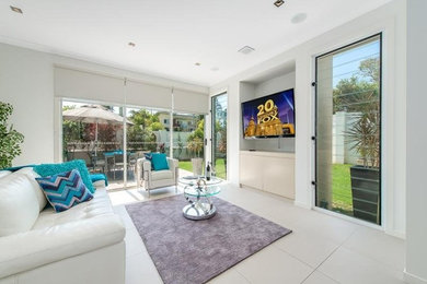 Design ideas for a modern home design in Gold Coast - Tweed.